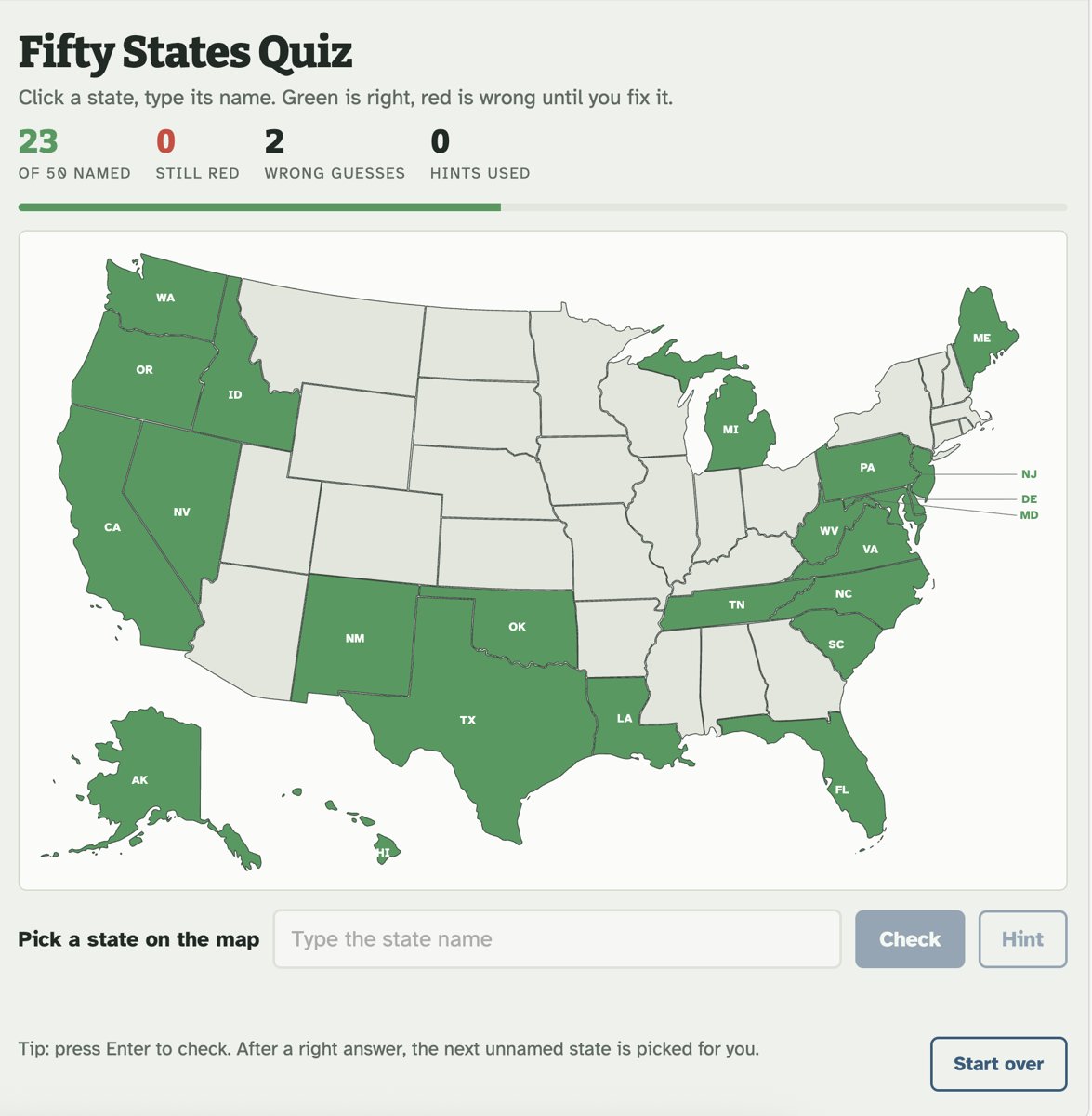 The Fifty States Quiz mid-game, with 23 of 50 states named and filled in green on a U.S. map